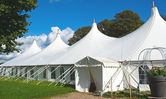 a line of sleek and modern porta potties ready for use at an upscale corporate event in Lyndeborough